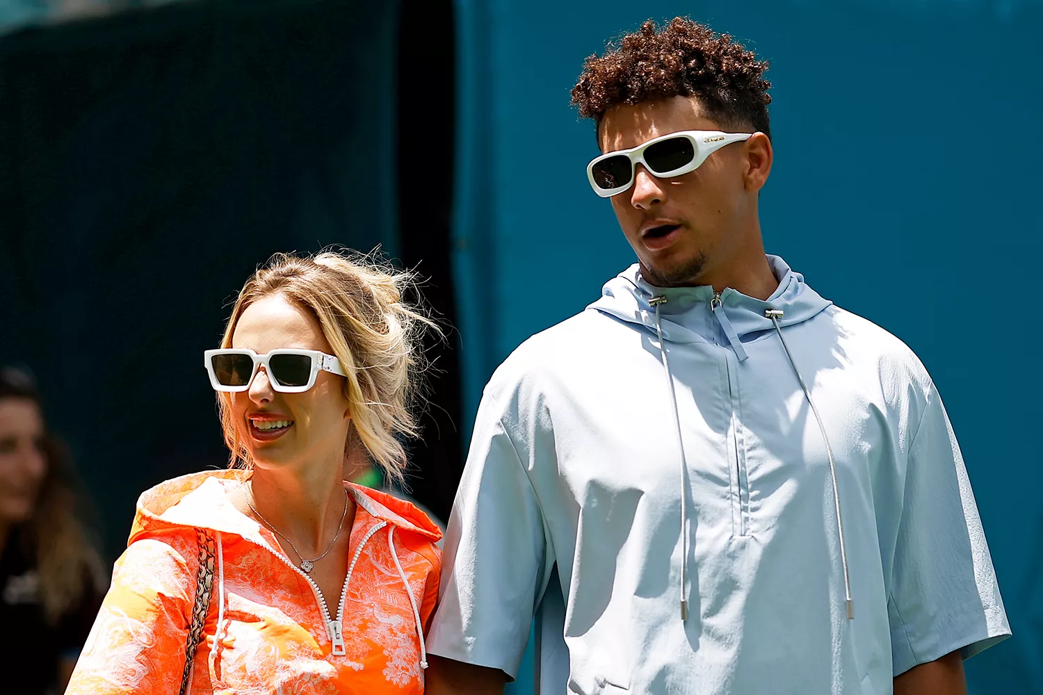 Patrick Mahomes and Brittany Mahomes walk in the Paddock prior to qualifying ahead of the F1 Grand Prix of Miami at Miami International Autodrome on May 04, 2024 in Miami, Florida.