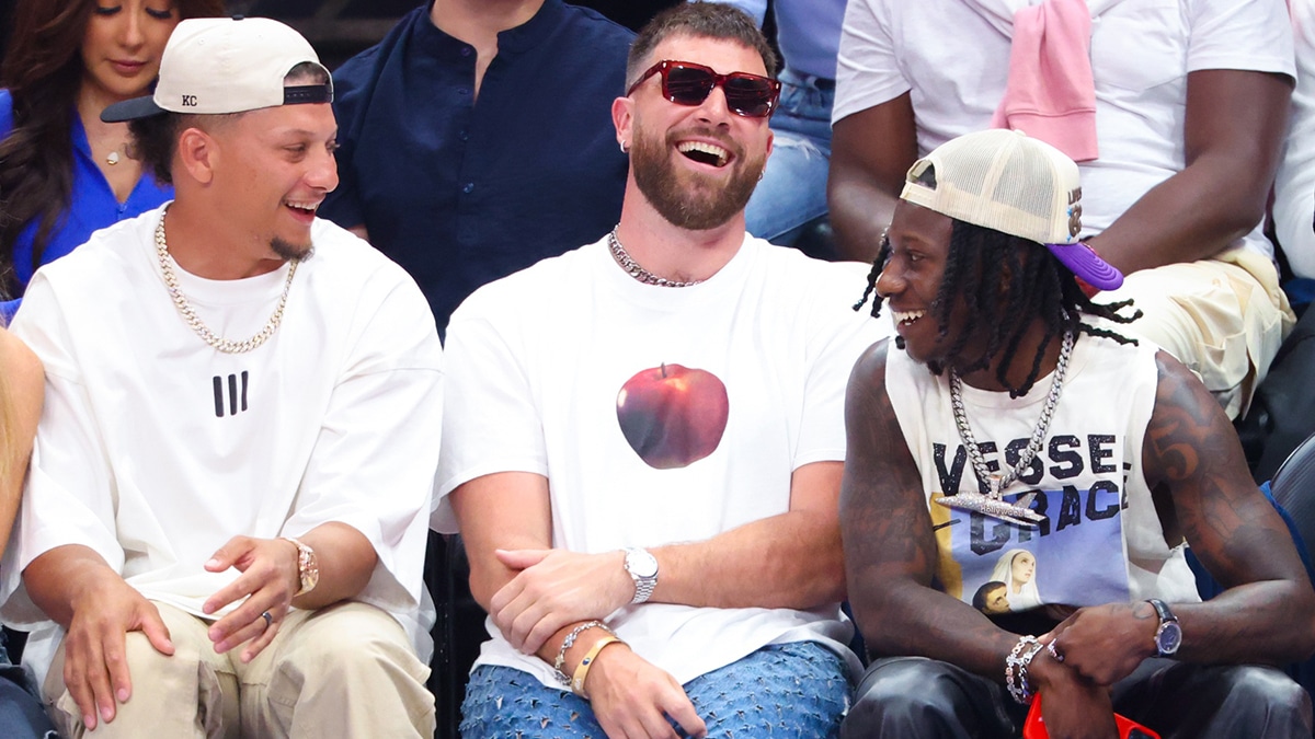 Kansas City Chiefs quarterback Patrick Mahomes II laughs with tight end Travis Kelce and wide receiver Marquis Hollywood Brown during the game between the Dallas Mavericks and Minnesota Timberwolves during game three of the western conference finals for the 2024 NBA playoffs at American Airlines Center