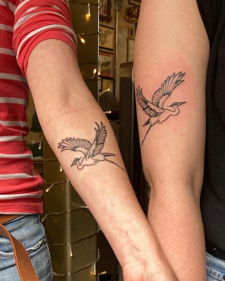 matching crane tattoos