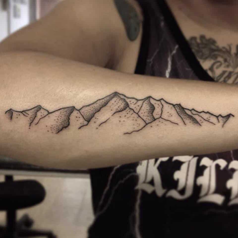 mountain tattoo on arm