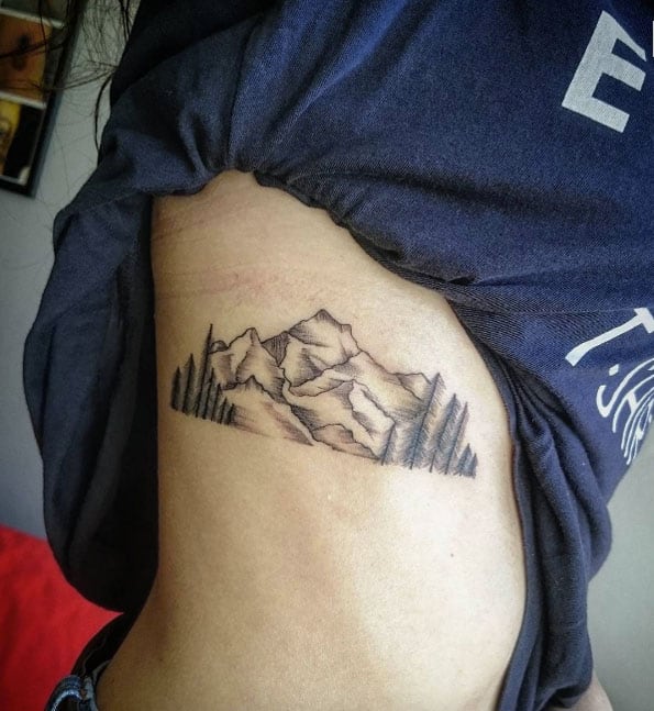 mountain tattoo on rib