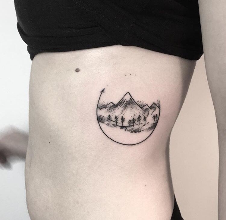 mountain tattoo on rib