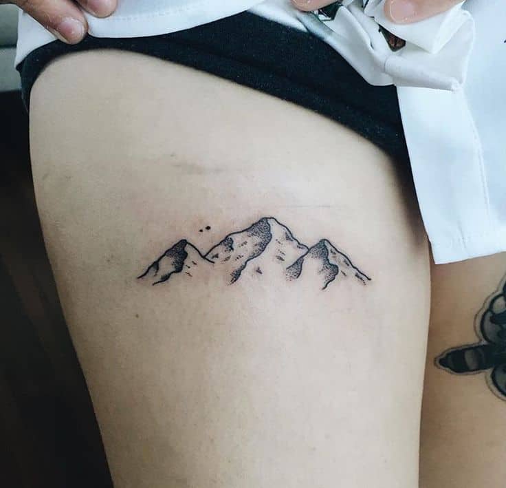 mountain thigh tattoo