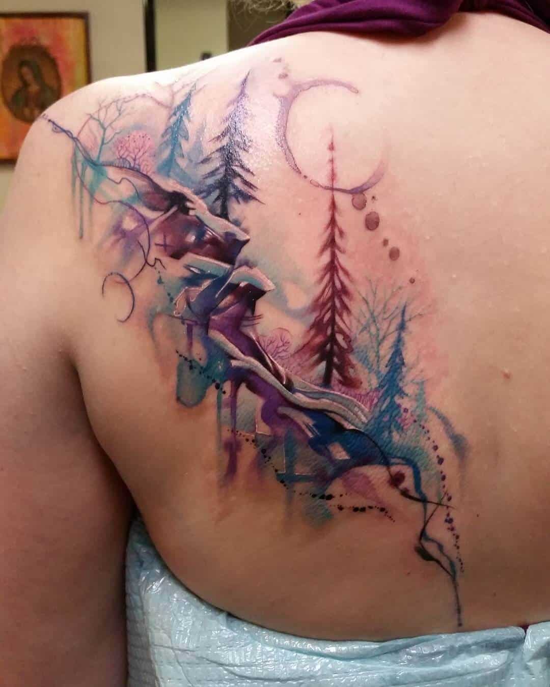 watercolor mountain tattoo on back