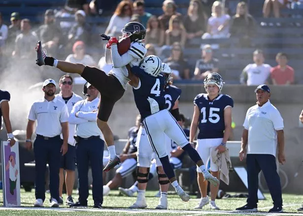 Brown Bears wide receiver Graham Walker makes the leaping catch during a game