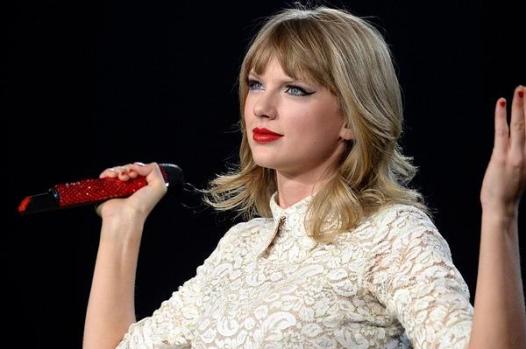 Taylor Swift performs during her Red Tour stop at Pepsi Center.