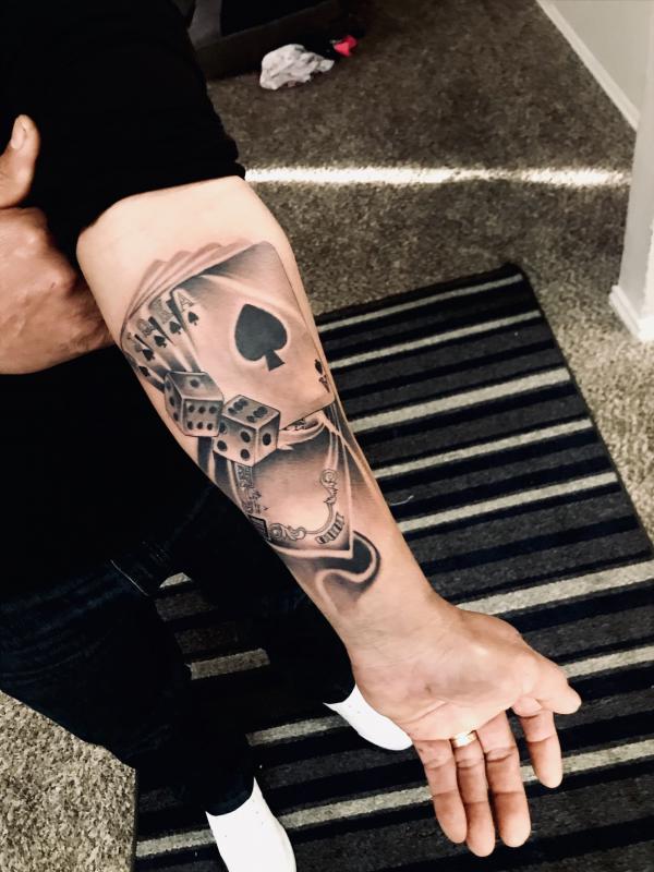 spade playing cards with dice tattoo forearm